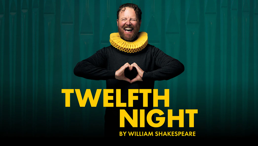 Actor in a ruff collar promoting Shakespeare's "Twelfth Night" play.
