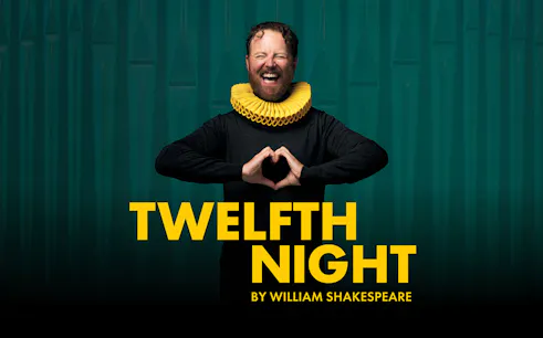 Actor in a ruff collar promoting Shakespeare's "Twelfth Night" play.