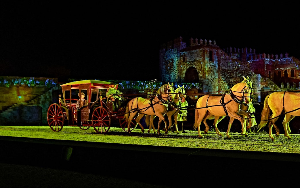 Horse-drawn carriage in The Dream of Toledo night show, Spain.
