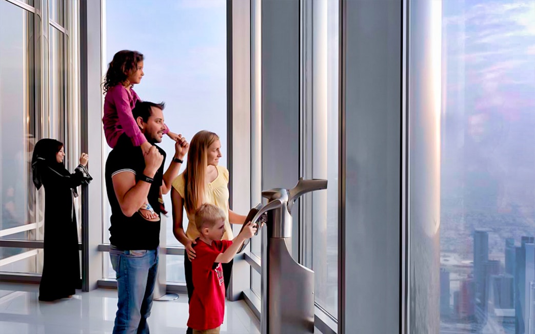 Visitors enjoying the view from Burj Khalifa's Level 124 observation deck.