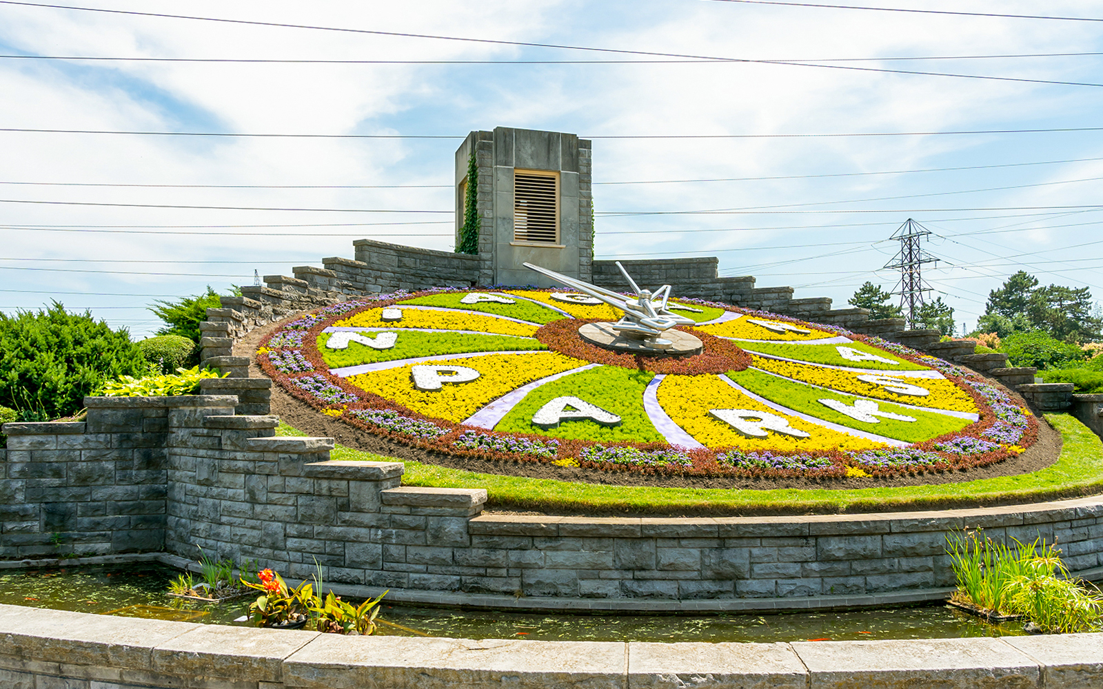 Floral Clock at Niagara Parks with colorful flower design and stone border.