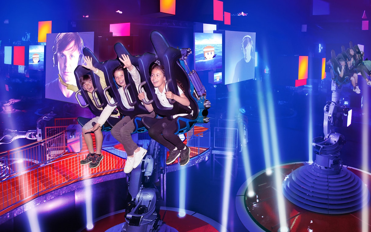 Visitors enjoying the Dances with Robots attraction at Futuroscope, France.