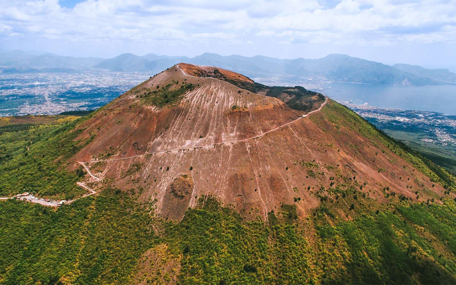 Mount Vesuvius with tourists exploring the crater, Naples, Italy, skip-the-line tickets experience.