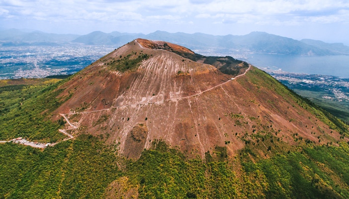 Mount Vesuvius with tourists exploring the crater, Naples, Italy, skip-the-line tickets experience.