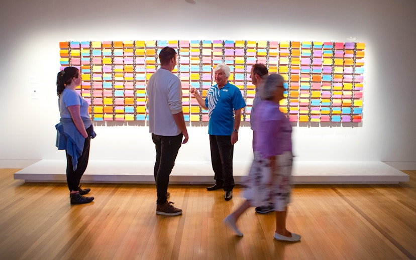 Visitors viewing colorful art installation at Museum of NZ Te Papa Tongarewa.