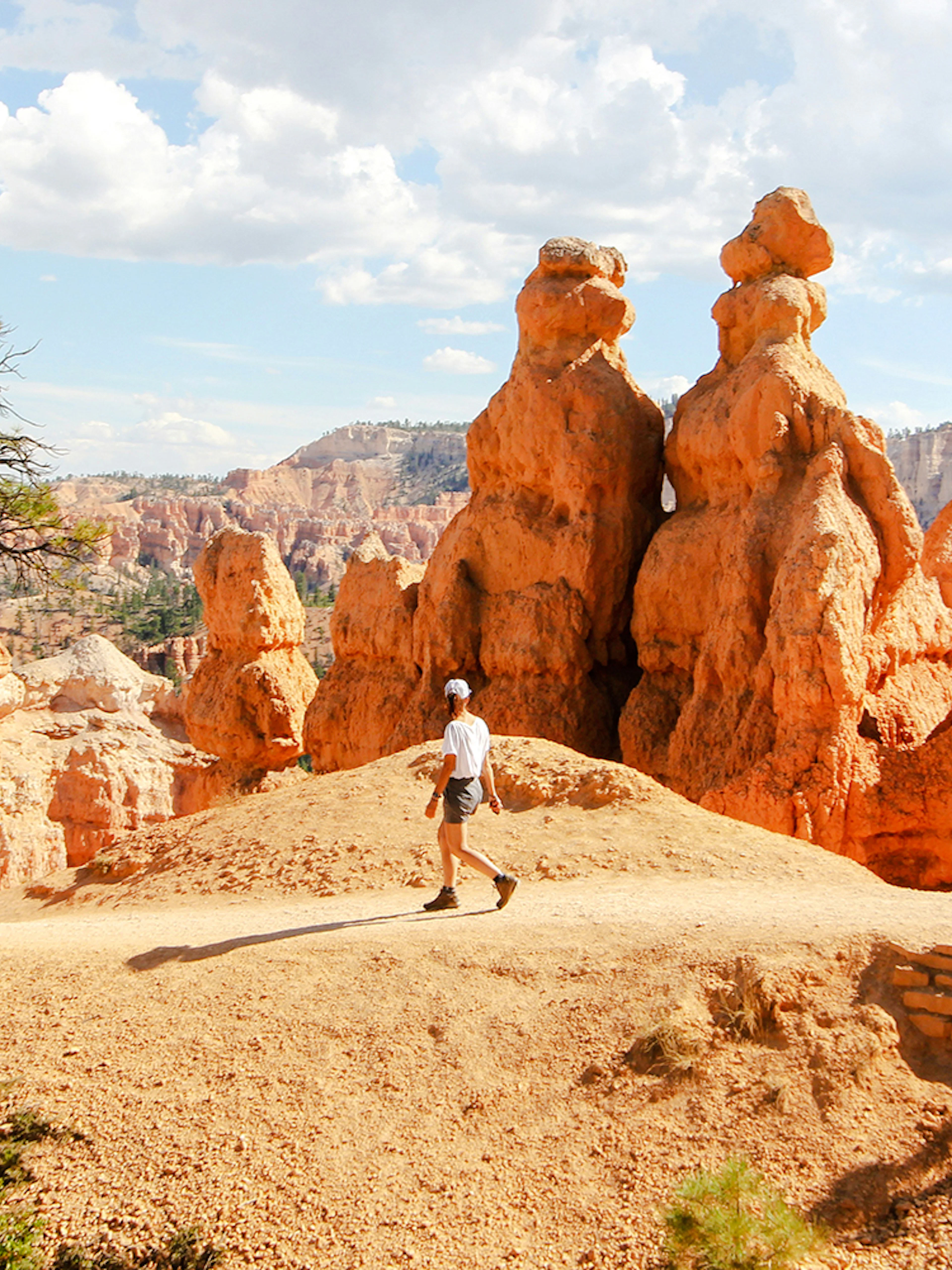 Person walking among hoodoos in Bryce Canyon National Park, Utah.