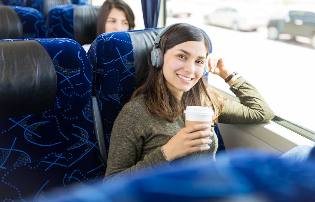 Woman sitting in public bus