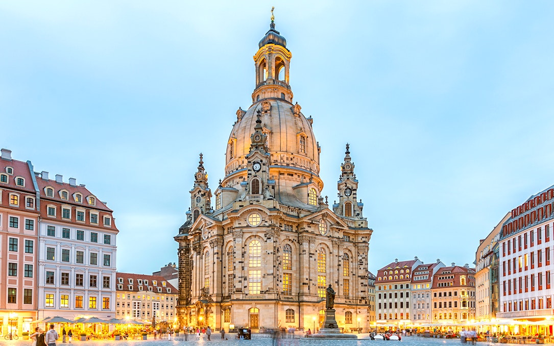 Frauenkirche Dresden illuminated at dusk during guided gallery tour.