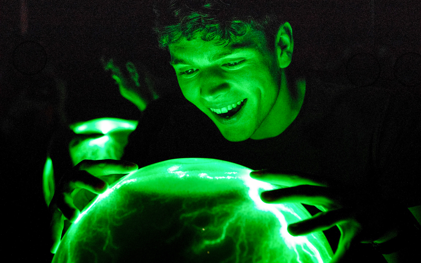 Person interacting with Crackle Ball at Camera Obscura & World of Illusions, Edinburgh.