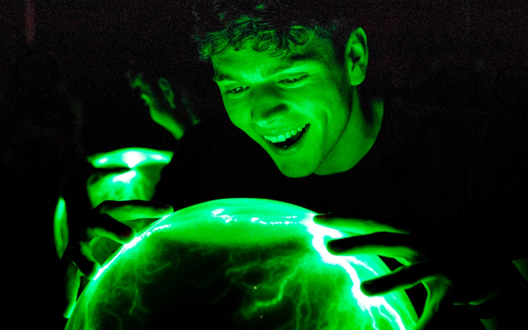 Person interacting with Crackle Ball at Camera Obscura & World of Illusions, Edinburgh.