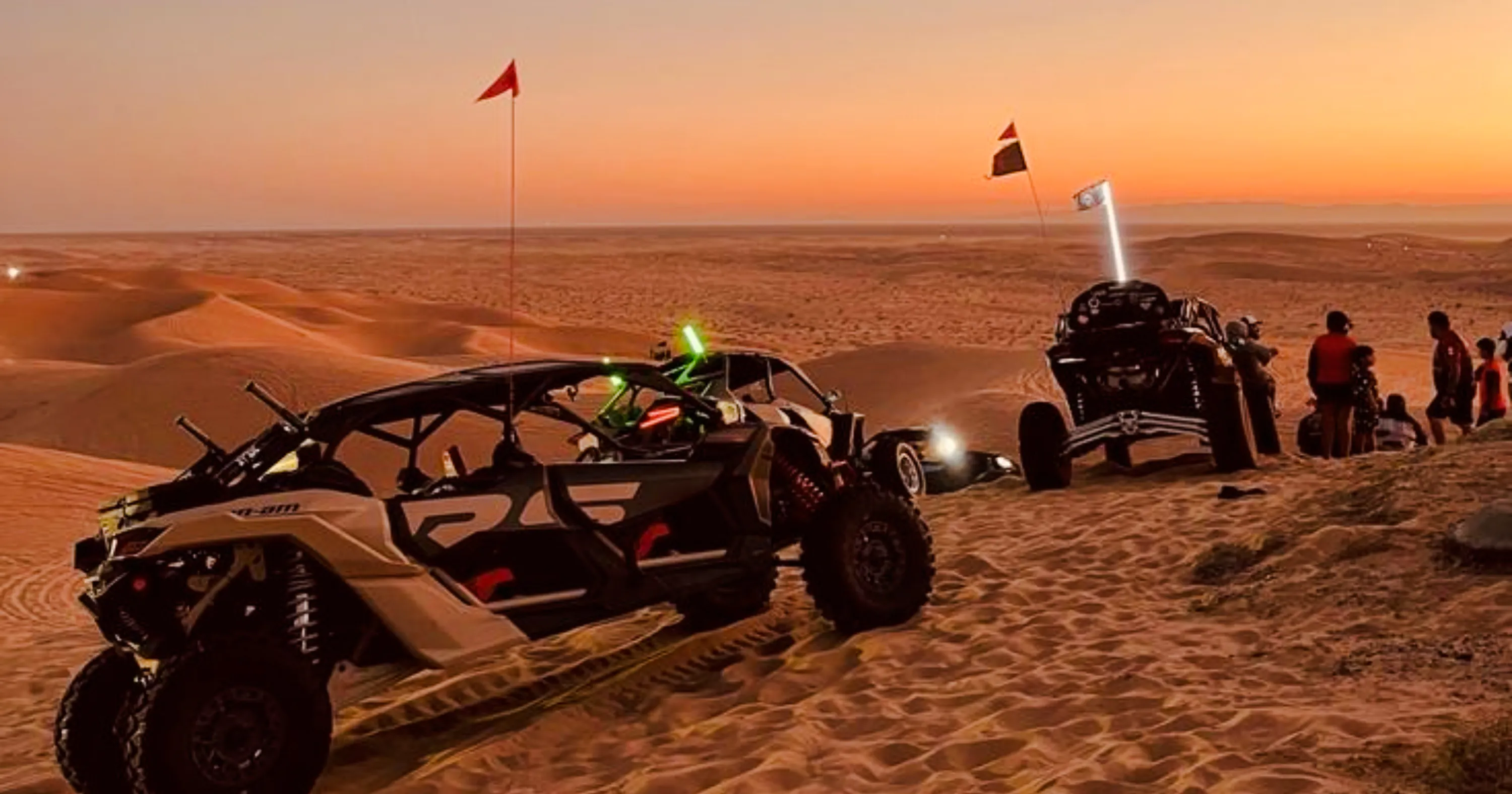 Buggy ride at sunset in Marrakech Palmeraie desert with group of people.