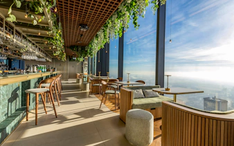 Rooftop lounge at Highline Warsaw with panoramic city views and modern seating.