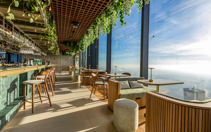 Rooftop lounge at Highline Warsaw with panoramic city views and modern seating.