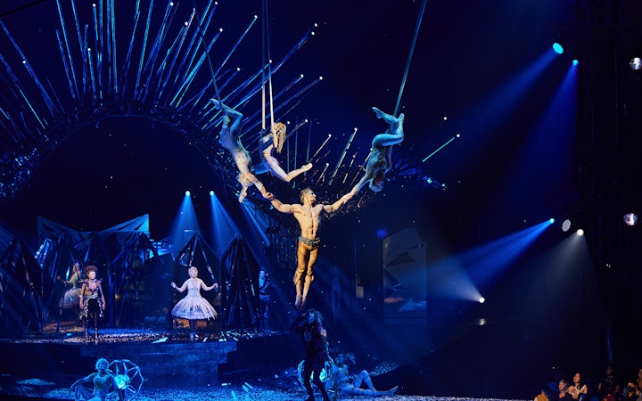 Acrobats performing aerial stunts at Cirque du Soleil: Alegría in Seville.