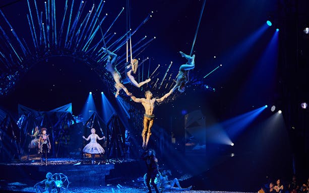 Acrobats performing aerial stunts at Cirque du Soleil: Alegría in Seville.