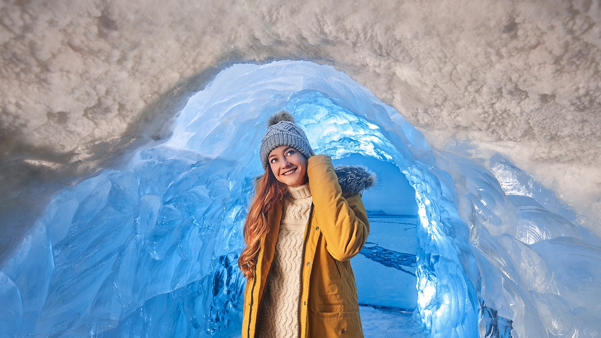 Women inside the ice cave of Perlan museums