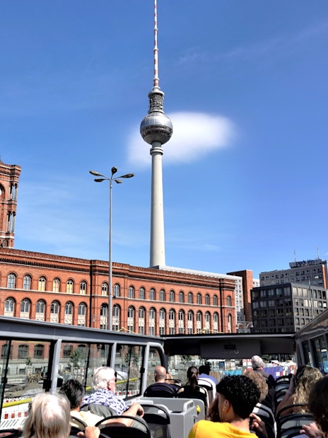 TV tower and red brick building viewed from City Circle Hop-On Hop-Off bus in Berlin.