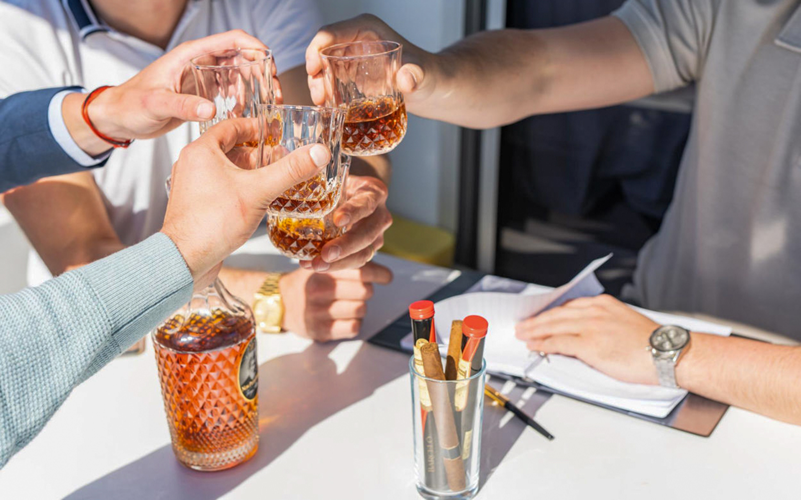 Group toasting with drinks on Prague VIP YachtBoat cruise.