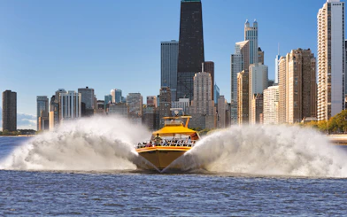 Speedboat on Lake Michigan with Chicago skyline in the background.