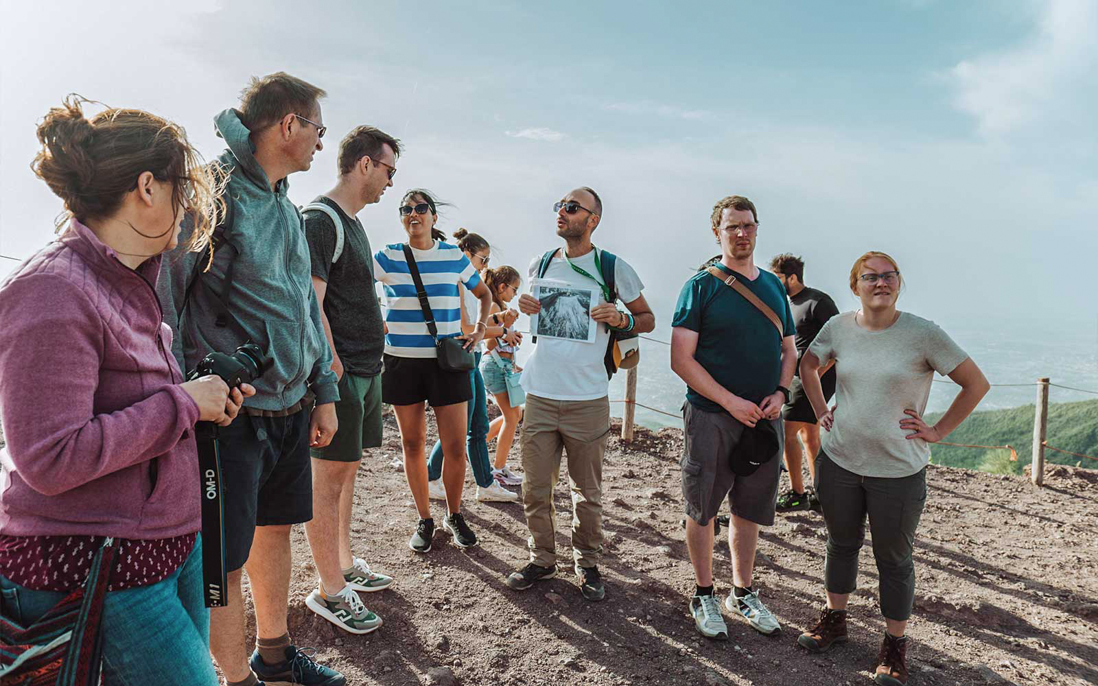 Guide explaining Mount Vesuvius to tourists