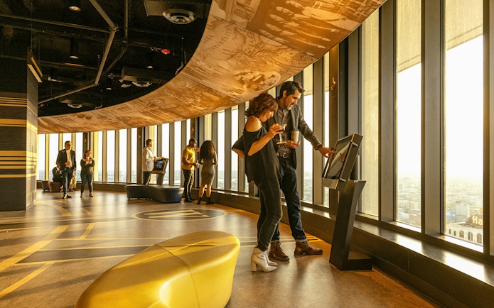 People using viewfinder at Vue Orleans Observation Deck, New Orleans.