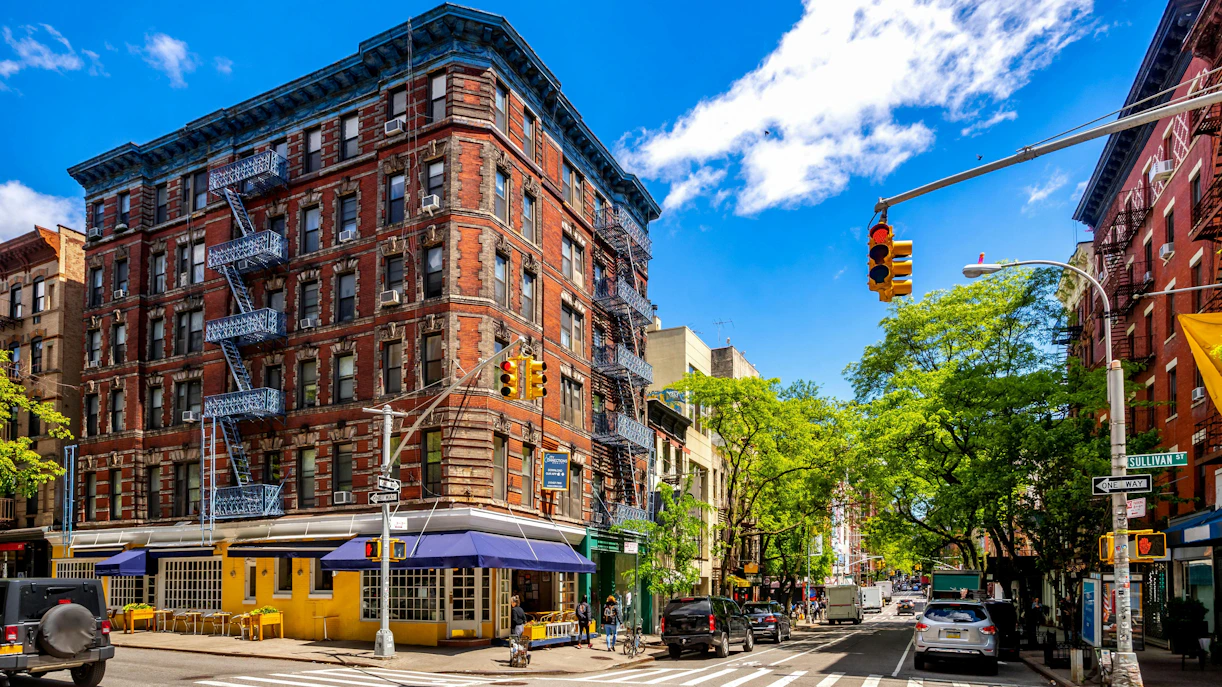 Historic building with fire escapes on Sullivan Street, SoHo, New York City, USA.