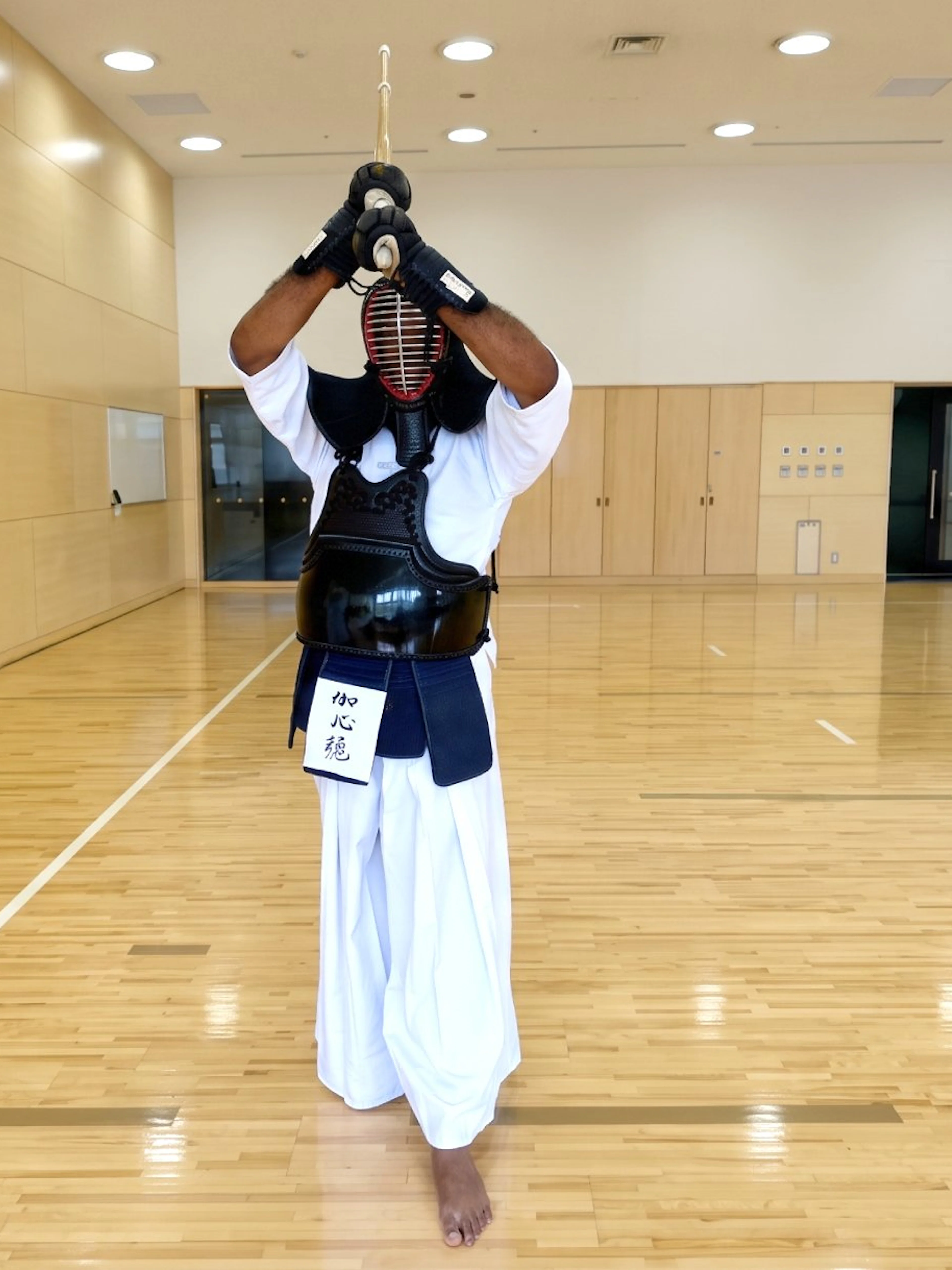 Samurai practicing kendo in a dojo during a Sapporo experience.