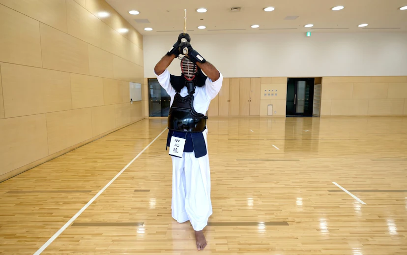Samurai practicing kendo in a dojo during a Sapporo experience.
