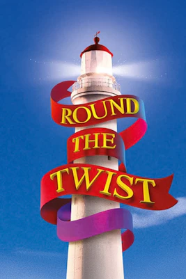 Lighthouse with "Round the Twist" ribbon against blue sky.