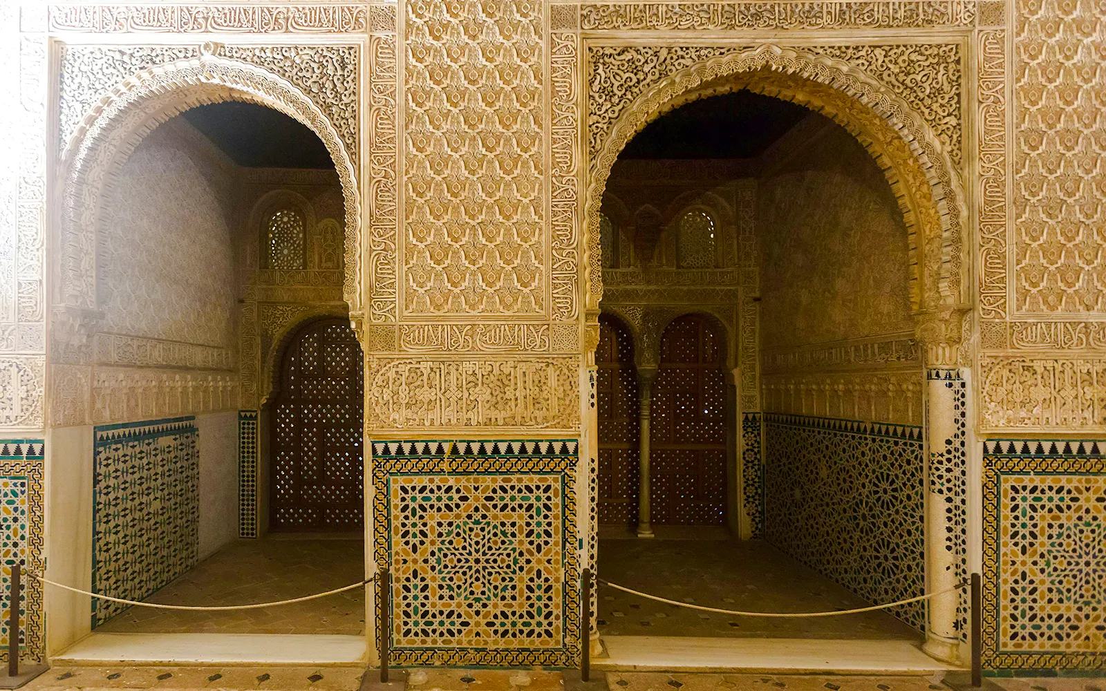 Intricate arches and tilework in the Hall of Ambassadors, Alhambra, Granada.