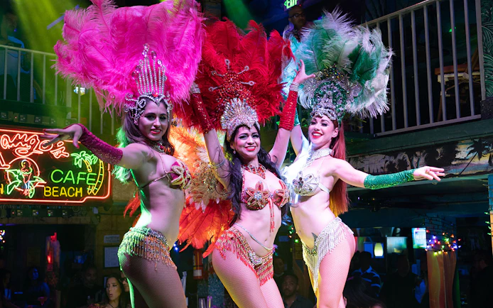 Salsa dancers performing at a vibrant Miami nightclub.