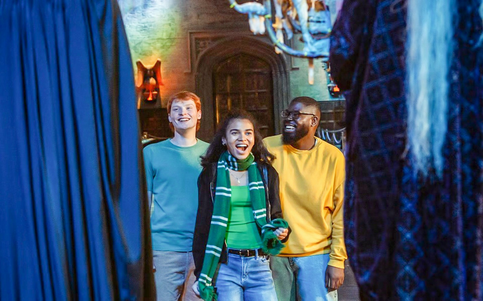 Visitors enjoying the Great Hall at Harry Potter Warner Bros. Studio Tour, London.