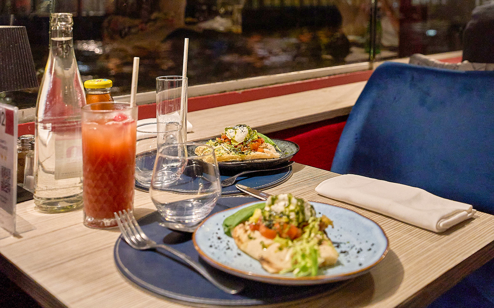 Dinner table with Italian dishes on the Théo Boat Seine River Cruise in Paris.