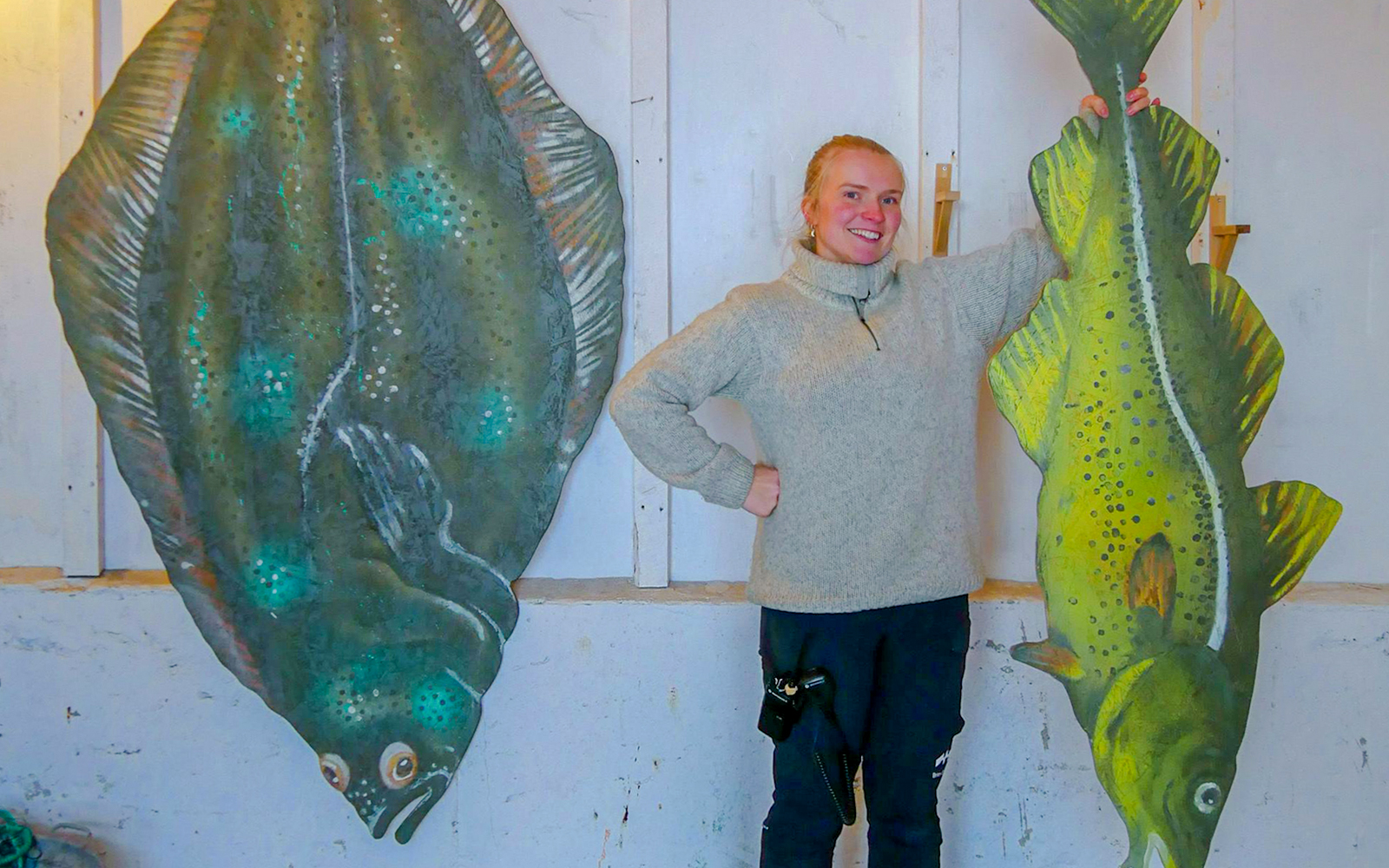 Guests exploring fish exhibits at Island of Rya.