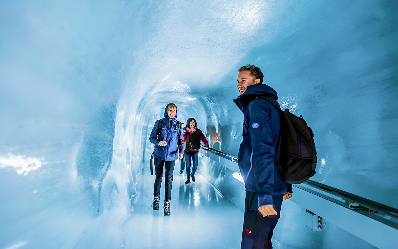 Person walking through an ice tunnel at Matterhorn Glacier Paradise.