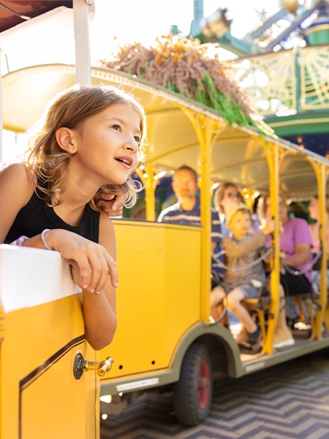 Children enjoying a train ride at Tivoli Gardens, Copenhagen.