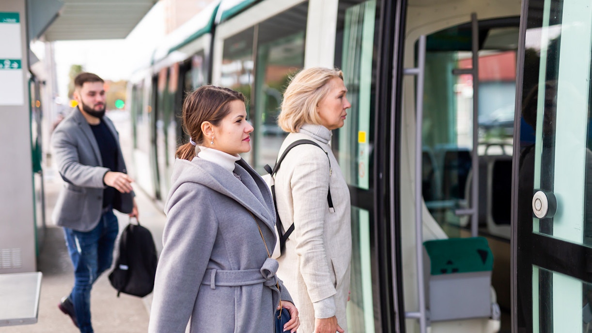 Passengers boarding a tram in Edinburgh.