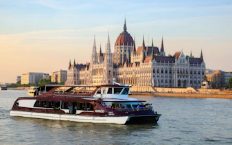 Cruise on the Danube River passing the Hungarian Parliament Building in Budapest.