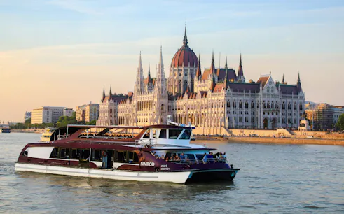 Cruise on the Danube River passing the Hungarian Parliament Building in Budapest.