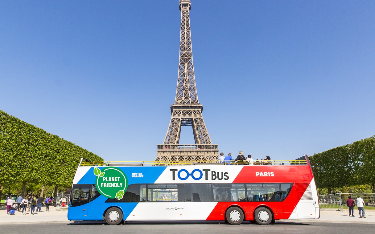 Hop-on hop-off bus near Eiffel Tower, Paris.