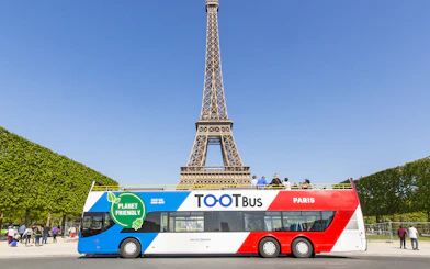Hop-on hop-off bus near Eiffel Tower, Paris.