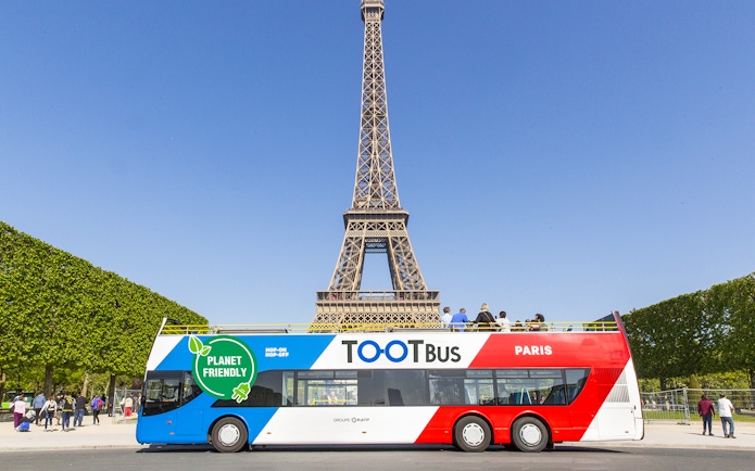 Hop-on hop-off bus near Eiffel Tower, Paris.