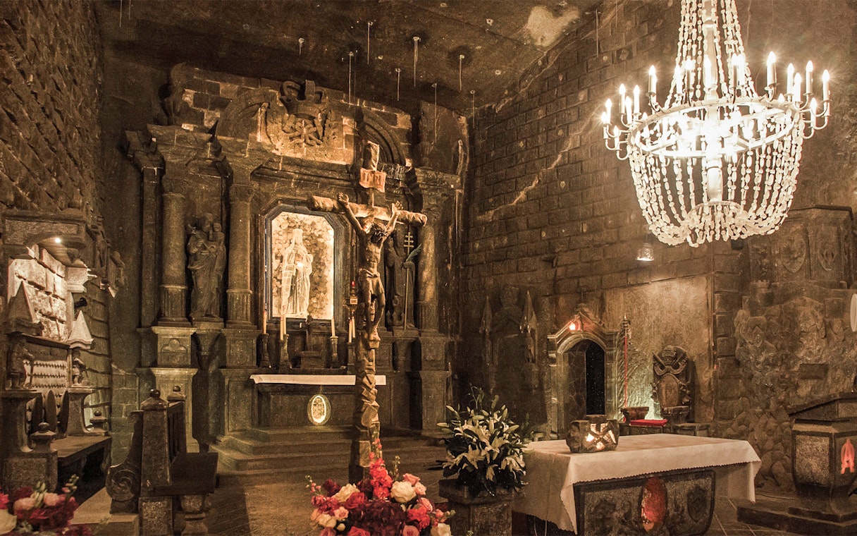 Wieliczka Salt Mine chapel with salt sculptures and chandelier, Krakow tour.