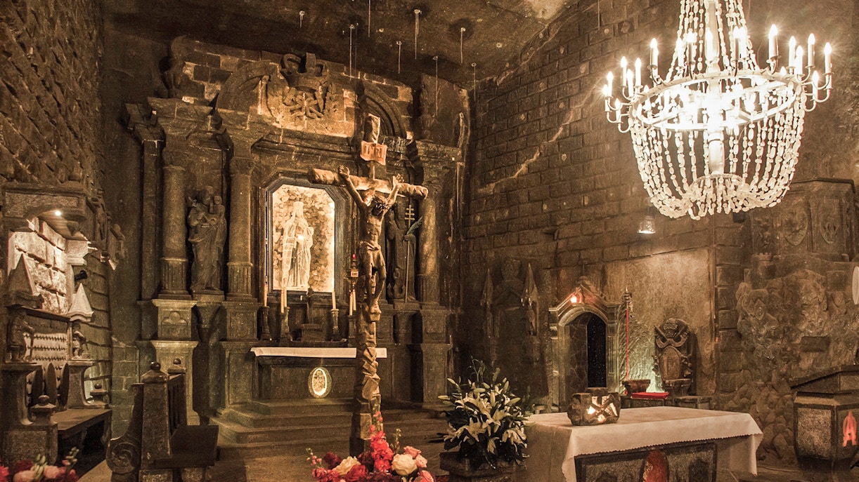 Wieliczka Salt Mine chapel with salt sculptures and chandelier, Krakow tour.