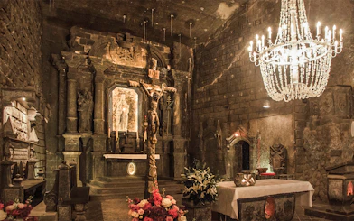 Wieliczka Salt Mine chapel with salt sculptures and chandelier, Krakow tour.