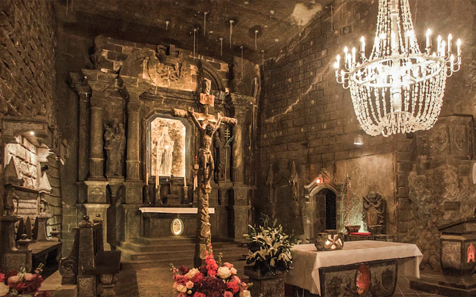 Wieliczka Salt Mine chapel with salt sculptures and chandelier, Krakow tour.