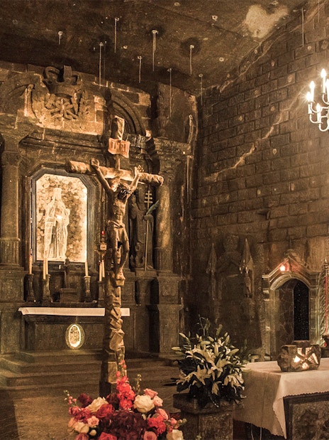 Wieliczka Salt Mine chapel with salt sculptures and chandelier, Krakow tour.
