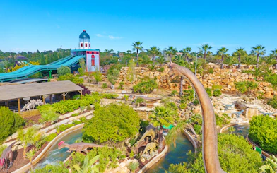 Aerial view of Zoomarine Algarve with dinosaur sculptures and water slides.