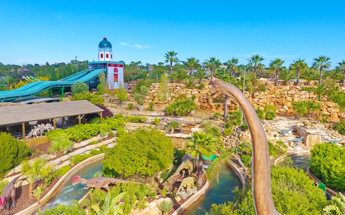 Aerial view of Zoomarine Algarve with dinosaur sculptures and water slides.