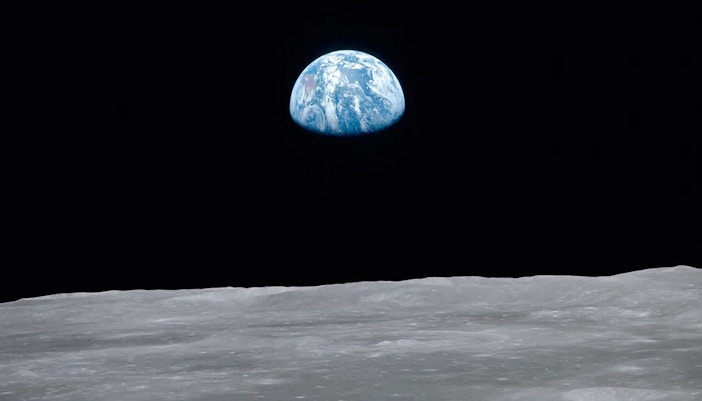 Earth rising over the lunar surface, featured in National History Museum's Story of the Earth exhibit.